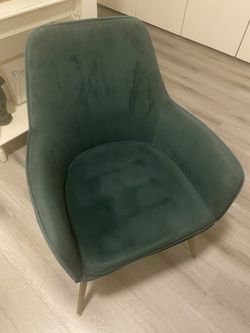 Dark green velvet covered chair