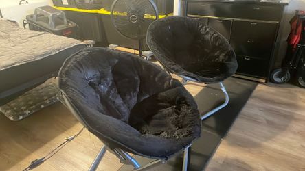 Two black saucer chairs