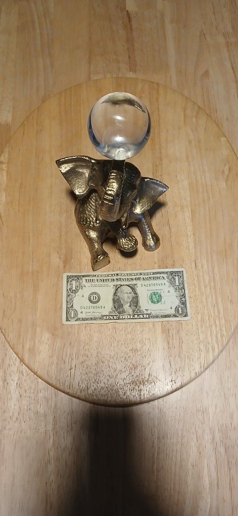 Elephant Holding Crystal Ball