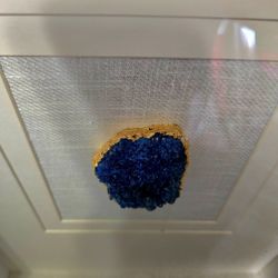 framed piece of deep blue azurite crystal, often referred to as a "blueberry" geode pair due to its saturated color and sparkly druzy texture. 12"×16"