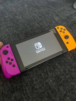 Working Nintendo Switch console with aftermarket grip joycons joy-cons