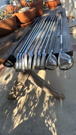 11 golf clubs. King Cobra irons no.s 3,4,6,7,8,9,W. 2 woods Taylor made , 1 putter cougar