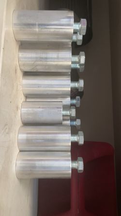 Spacers for rear seat lift kit