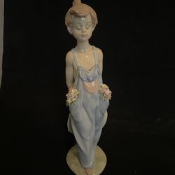 Lladro Porcelain Figurine of a Boy with Flowers