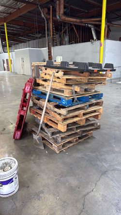 Stack of Used Wooden Pallets