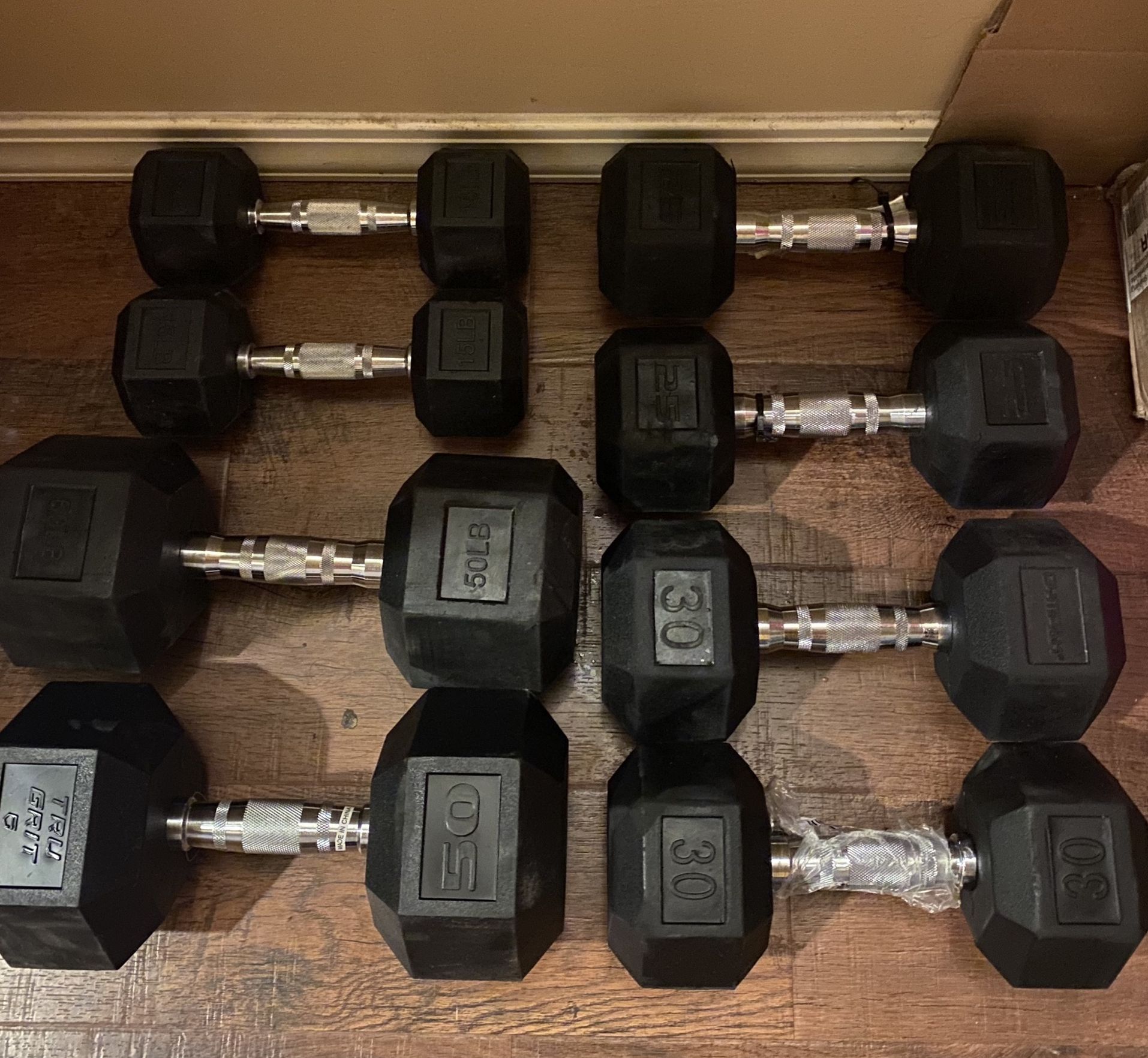 New, rubber hex dumbbell pair of 15lb, 25lb, 30lb and 50lb- $1.5/lb