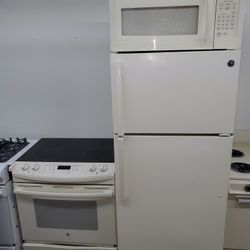 Stove  fridge  and microwave baige  side 30 or 28 fridge great condition,, look new warranty ready to deliver all 3 item