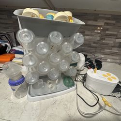 Medela Breast Pump With Various Storage Bins