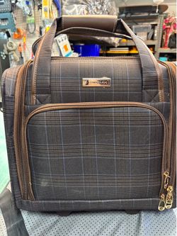 London fog travel bag with wheels and handle lots of compartments   Measures 15” tall 14” wide 9” deep  Brown/Blue pattern