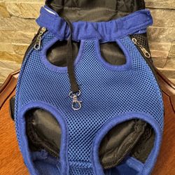 Blue mesh pet carrier backpack designed to carry a small dog or cat with its legs out EUC
