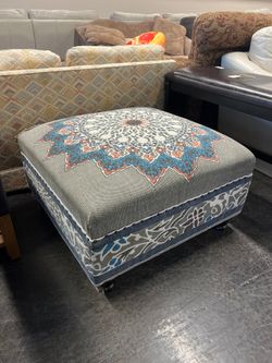 Decorative Upholstered Ottoman with Medallion Pattern and Nailhead Trim