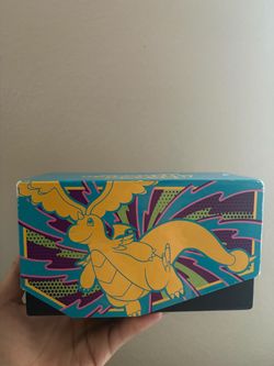 Pokémon Dragonite box with different cards (some in protective covers)