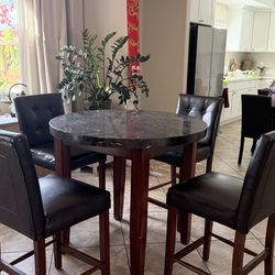 Round table + 4 chairs