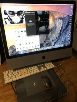 iMac with keyboard and pad pen mouse
