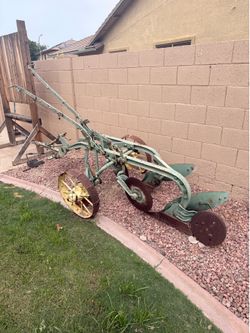 John Deere Antique Plow with Steel Wheels