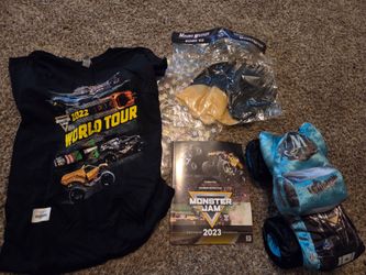 Monster Jam souvenir 2023 bag . T-shirt,  book, Whiplash truck plush & Mohawk wig 
I have 2 bags available one sealed and one open for pictures.  The 