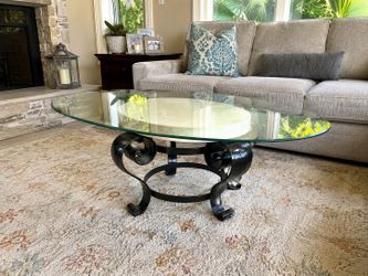 Elegant Oval Glass Coffee Table with Stone & Scroll Base