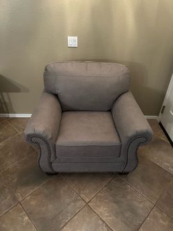 ignature Design by Ashley Olsberg Faux Leather Chair with Nailhead Trim, Gray