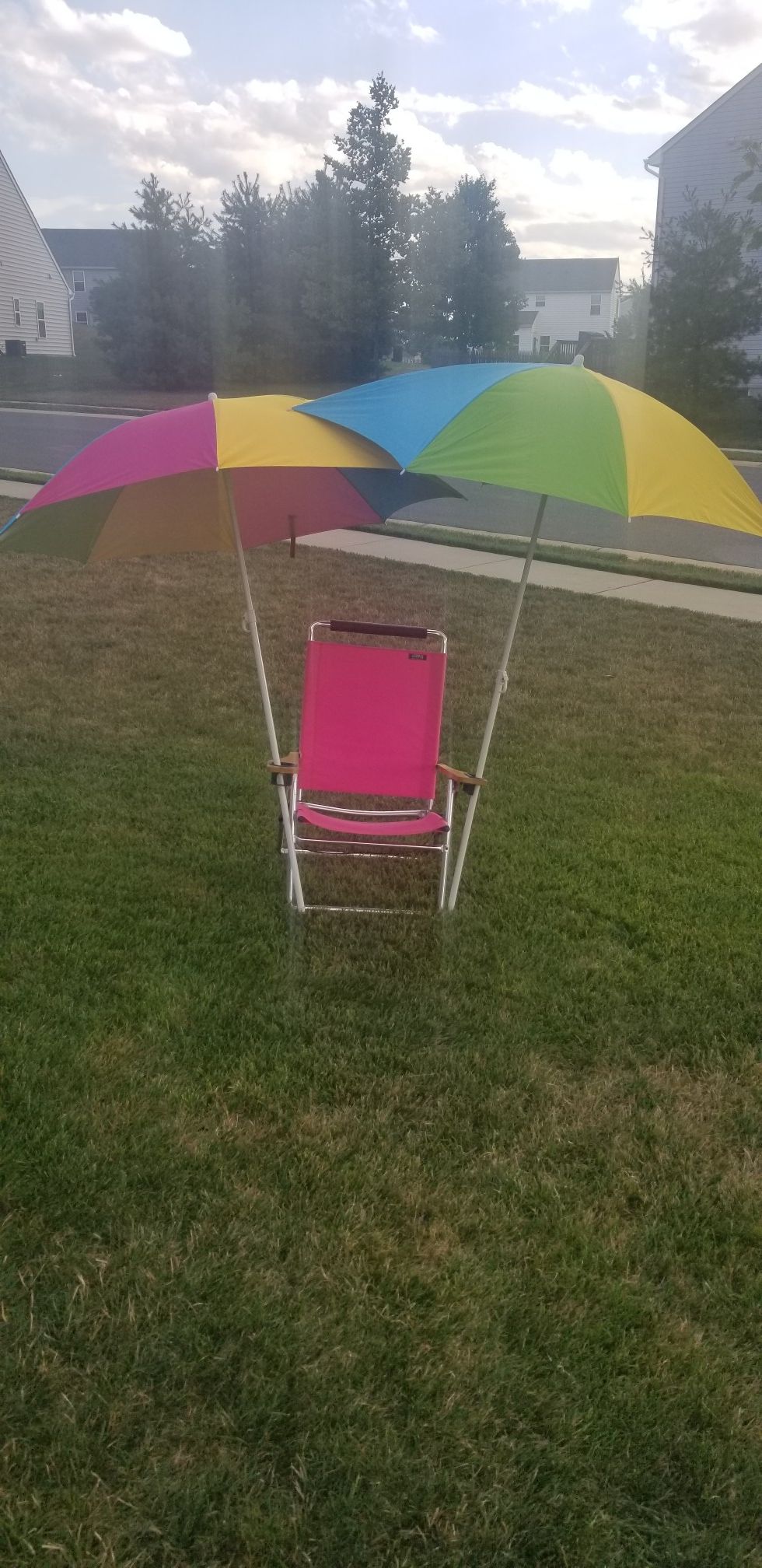 BEACH CHAIR AND TWO UMBRELLAS