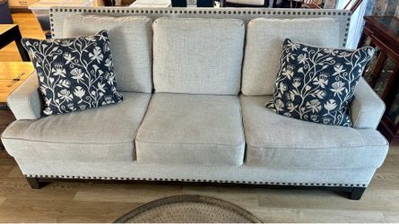 Gray linen Ashley Ballina couch with distinctive bronze nailheads-$100