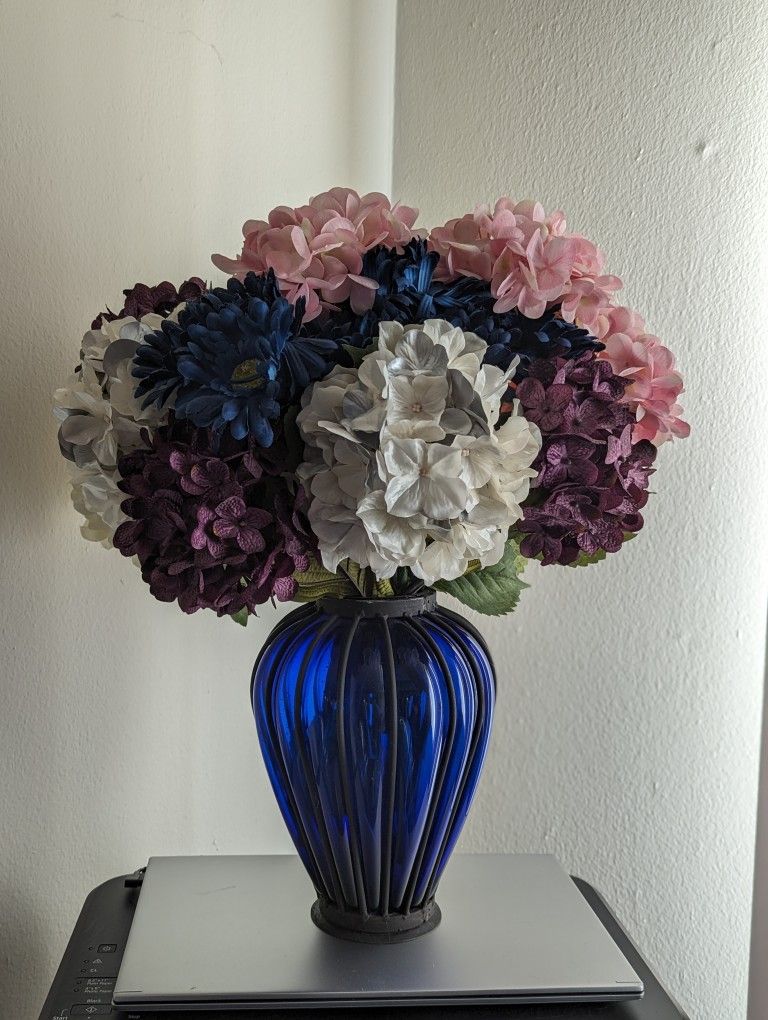 Blue Glass and Black Iron Vase with Flowers