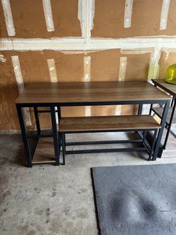 Dining table with wine rack and benches