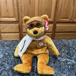 Ty Beanie Babie “Bearon” 100 Years Of Flight.  Year 2003.    Size 7 inches tall.  Sits  up.  Brand New with Tags.  