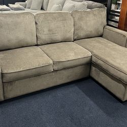 Warm grey reversible sleeper sectional w/ storage