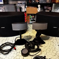Two Bose companion 5 satellite speakers and two Bose 201V bookshelf loudspeakers