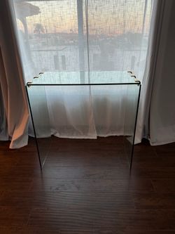 Glass Console Table with Gold Corner Brackets