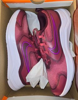 Nike Cosmic Runner Big Kids' running shoes in a striking Sweet Beet/ Vivid Purple
