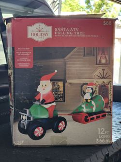Santa ATV pulling tree