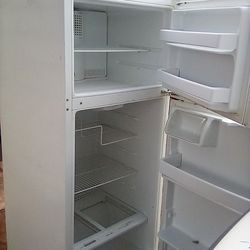 GE refrigerator, White in color,