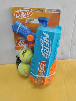 Nerf Dog Compact Blaster tennis ball launcher packaged with two tennis balls