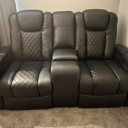 Black leather dual power recliner love seat