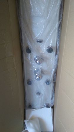 New Shower panel with 6 jets plus shower head, hand sprayer, shampoo tray. Never installed.