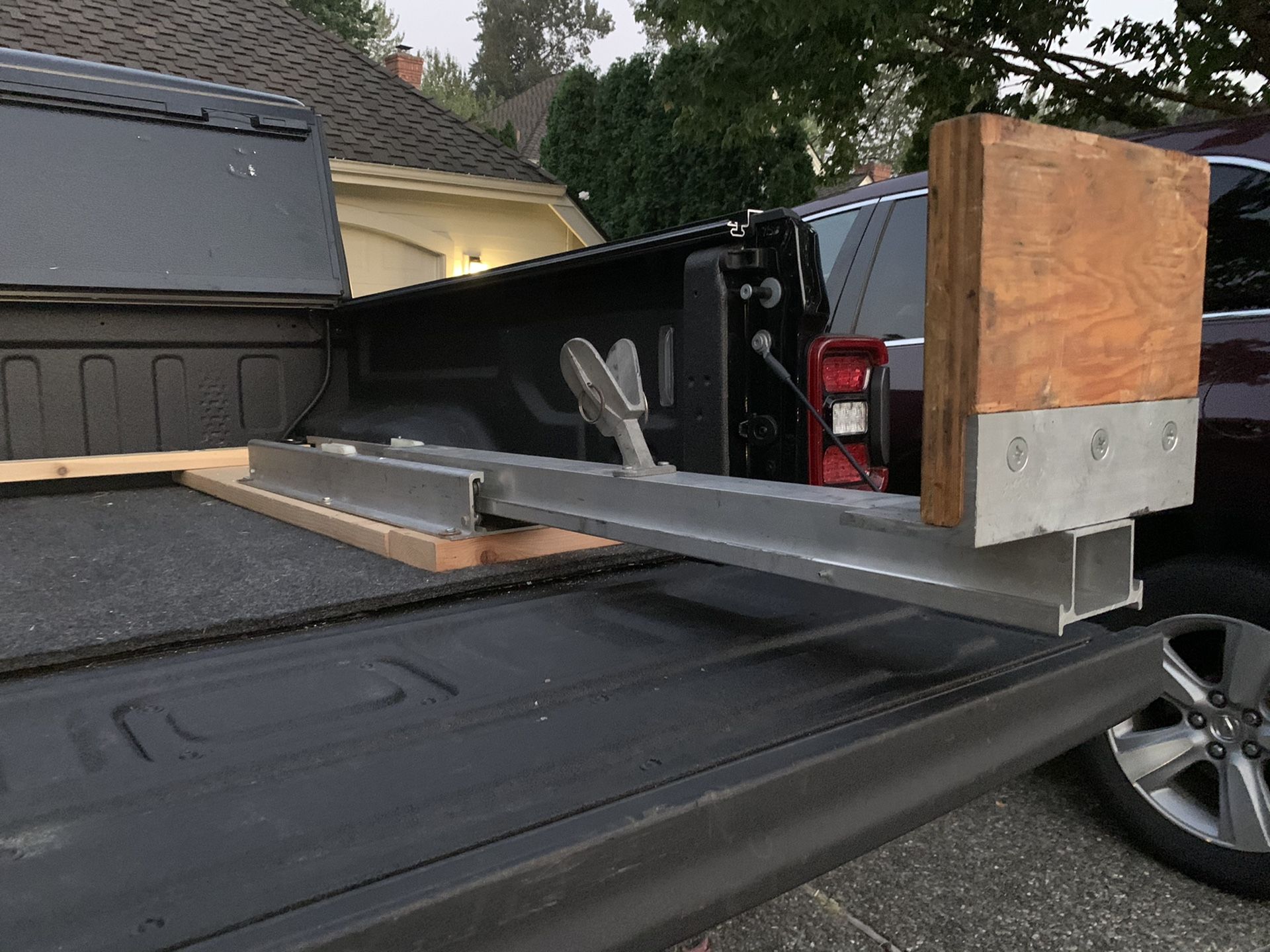 Eide outboard boat motor carrier for pickup truck