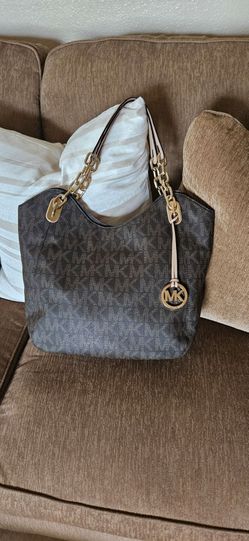 Michael Kors MK Signature Large Shoulder Bag featuring gold-tone chain strap accents and signature hanging MK circle logo charm
