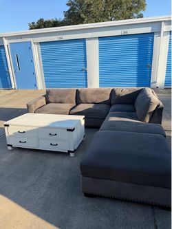 Grey sectional and coffee table