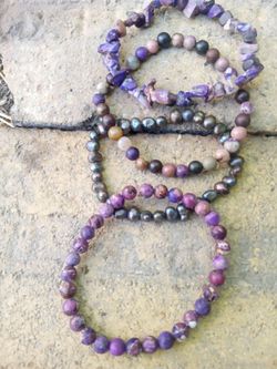 Assortment of Purple tourmaline Jadiete precious gem stones and real fresh water pearl bracelets