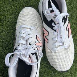 Women New Balance 009 athletic sneakers in white, black, and pink size 7.5