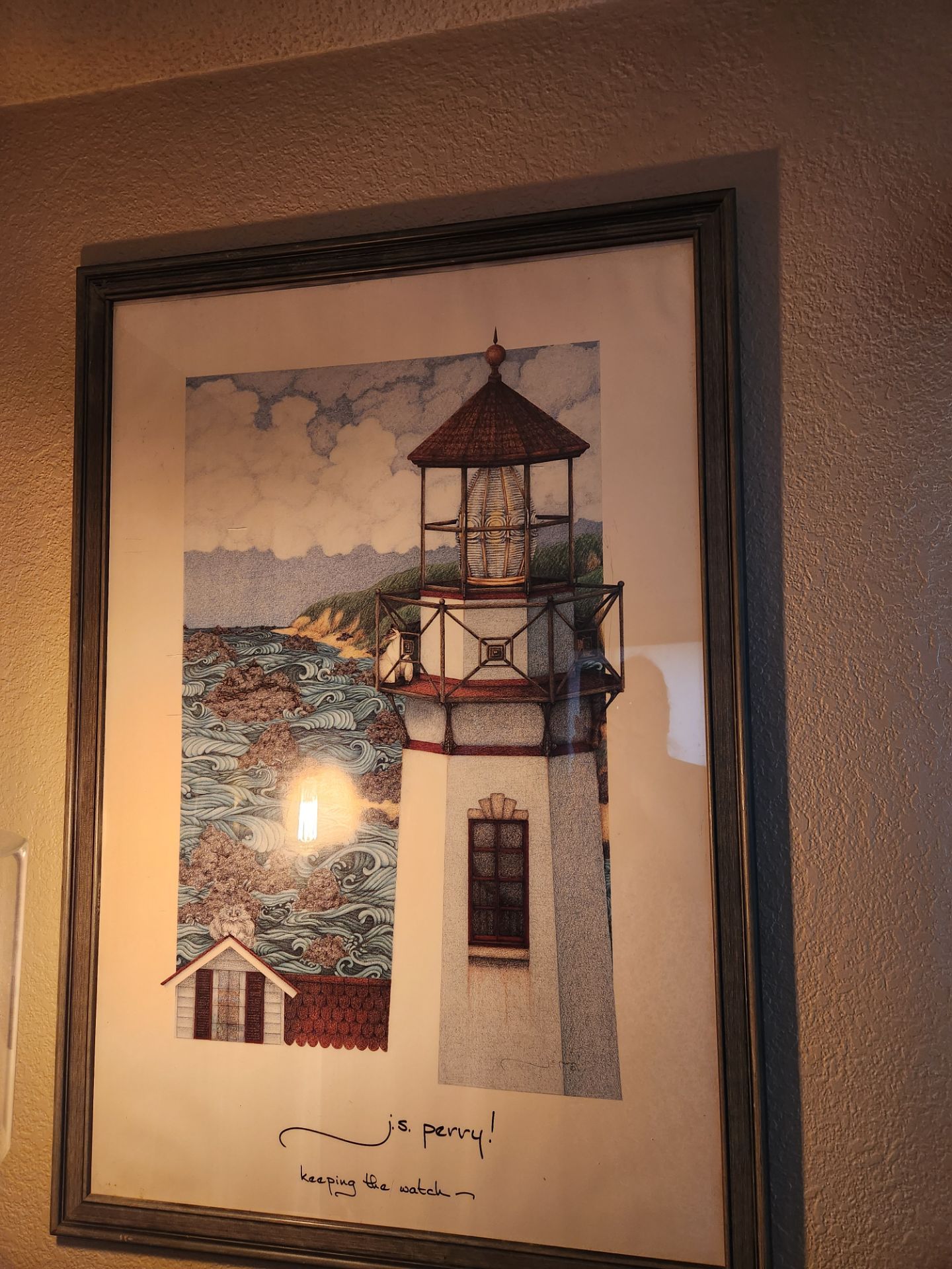 Lighthouse and cats framed picture
