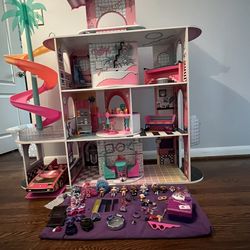 a LOL! OMG! LOL! House Of Surprises Doll House With Extras!