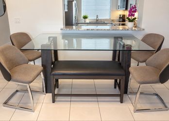 Dining table with four chairs and bench