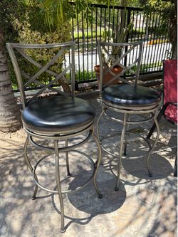 Metal framed spinning bar chairs.