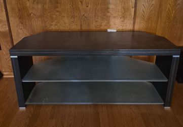 Black TV stand with glass shelf