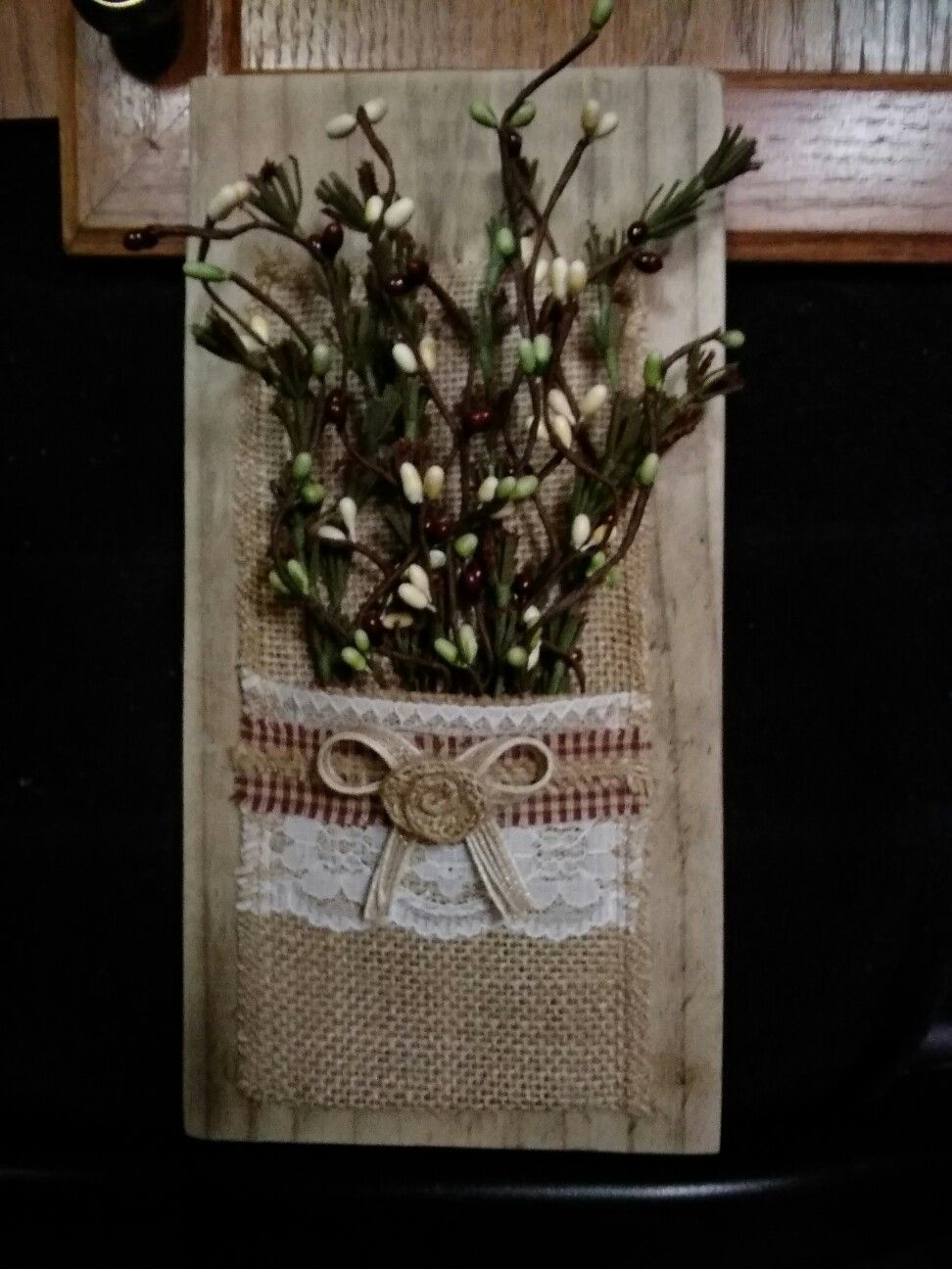 Wooden wall hanging with burlap flower holder