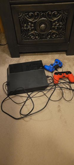 PlayStation 4 (Ps4) console with cd game drive included and online games store available  as well!!