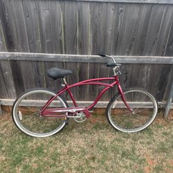 Red Huffy Good Vibrations men's cruiser bicycle