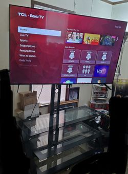 65inch TCL Roku with tv stand and surround speaker
